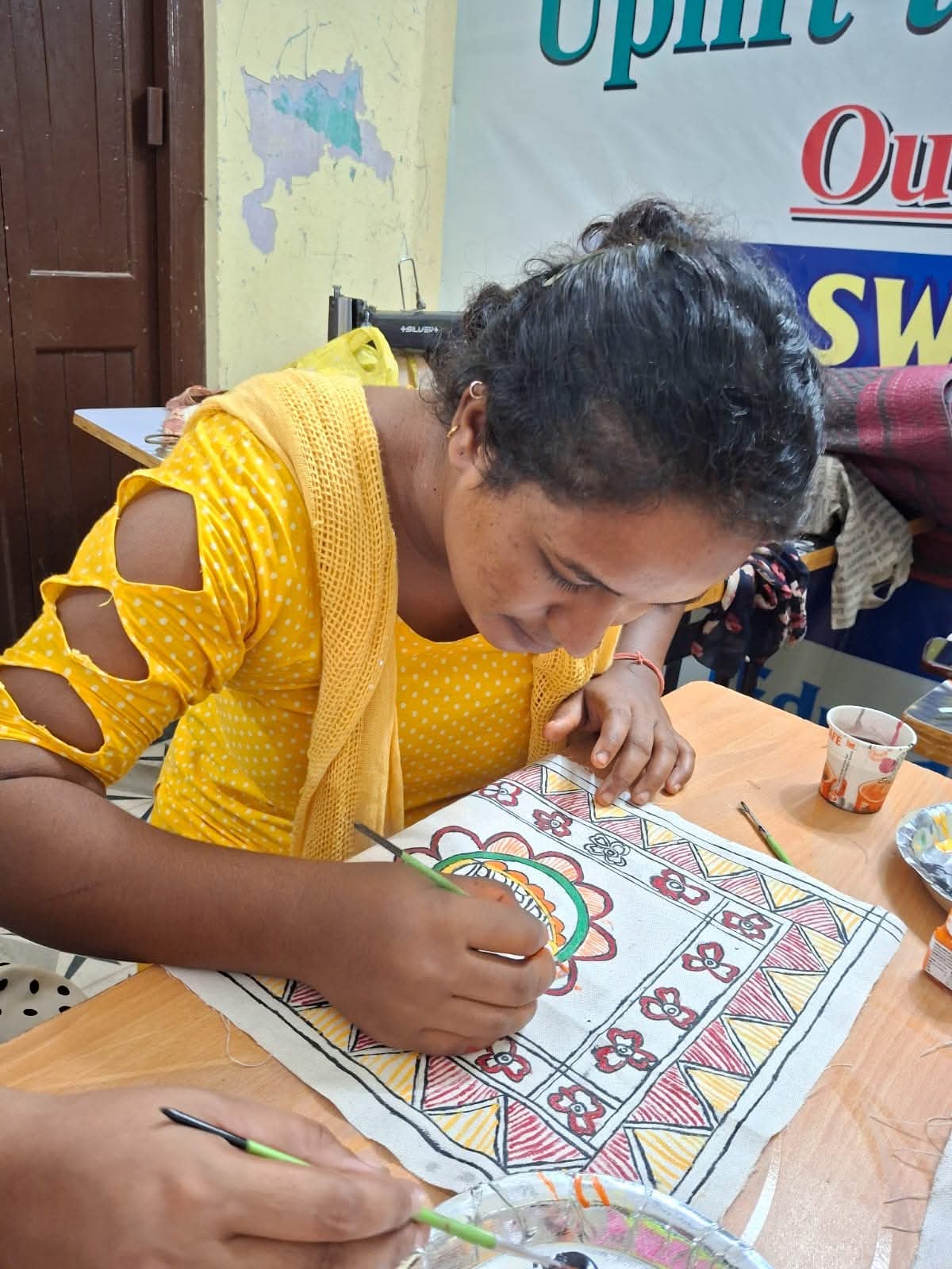 A woman working at her own sewing machine at home